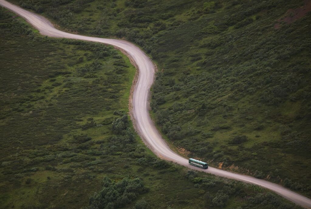 A park bus on the Denali Park Road near Igloo Canyon