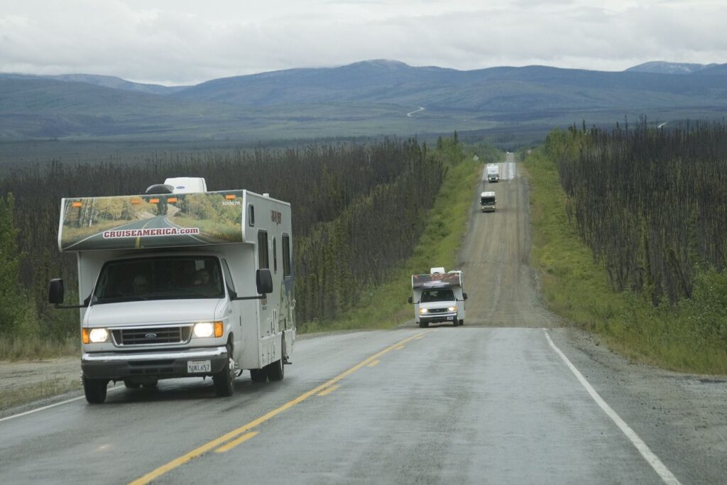 An RV caravan on an Alaska highway